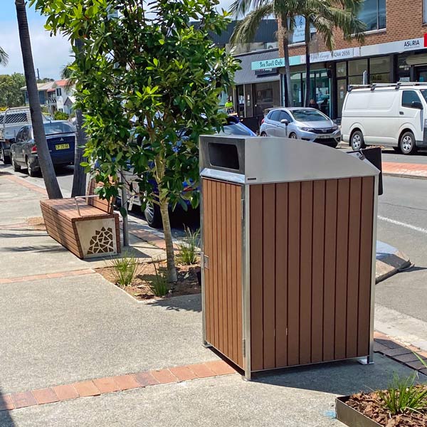 Bin surround with timber sides and curved cover