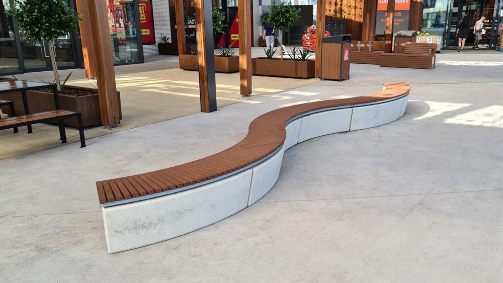 Curved outdoor bench with concrete base