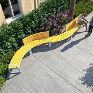 Snaking public seat and bench configuration along a walk way in front of a garden bed