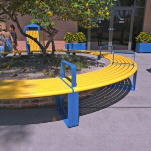 Curved Benches forming a circle around a lemon tree in a raised garden bed with a school building in the background