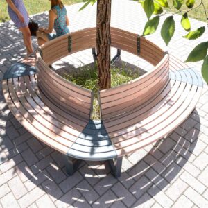 Modular commercial outdoor curved seats with backrest placed around the shade of a tree with a central garden bed.